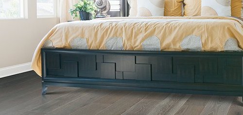 Bedroom with hardwood flooring and yellow bedding