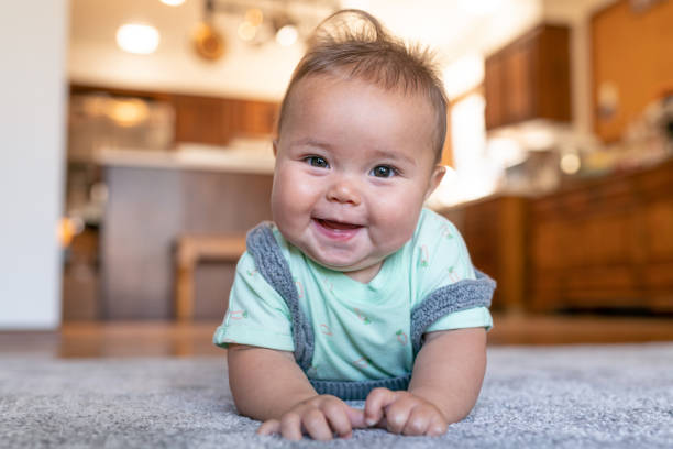 Baby lying on floor | Haley's Flooring & Interiors